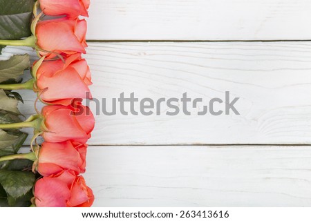 beautiful bouquet of  roses on white wood surface