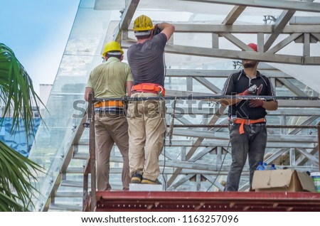 construction worker on a scaffold, symbol photo for building, construction boom, labor protection