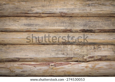 a wall made of rough pine boards nailed lap