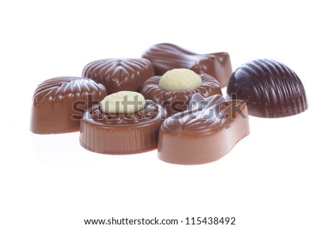 chocolate pralines on white background. Delicious dark and milk chocolate pralines.