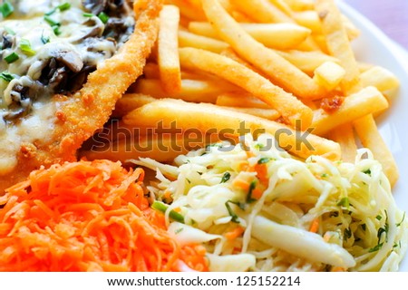 chicken steak with fries / chips and salad