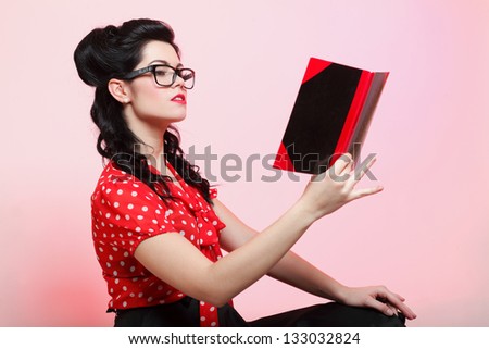 Portrait of a young woman, college student or teacher notebook in hand