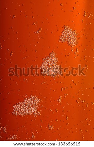 closeup - orange motor oil with bubbles texture background