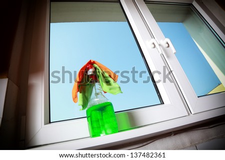 Cleaning window using tools - rag and spray detergent. Spring cleaning concept