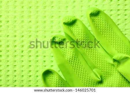 Close up Grenn kitchen sponge and rubber glove