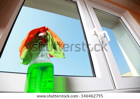 Cleaning window using tools - rag and spray detergent. Spring cleaning concept