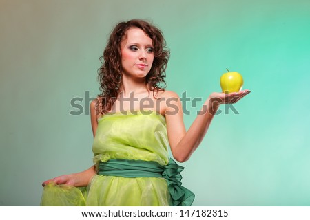 Beautiful spring woman with apple. Green or dieting concept. Healthy eating