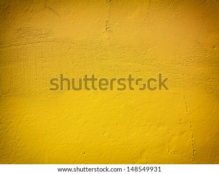 Yellow orange paint concrete wall background or texture