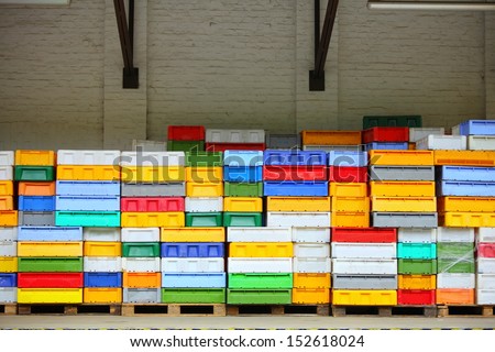 colorful boxes plastic crates. Packing containers piles for fish storage of catch.