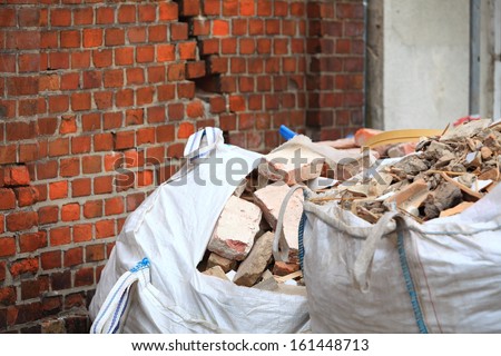 Full construction waste debris bags, garbage bricks and material from demolished house