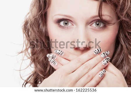 Speak no evil concept. Surprised woman face, girl covering her mouth with hands over white background