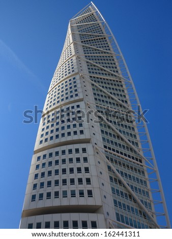 MALMO, SWEDEN- AUGUST 7:Turning Torso skyscraper on August 7, 2013 in Malmo Sweden. Designed by Santiago Calatrava, it is the most recognized landmark of Malmo today.