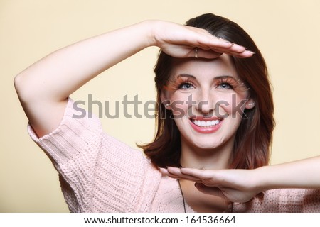 Autumn woman fashion female stylish creative make up false long brown eye lashes autumnal colour. Girl framing her face with hands