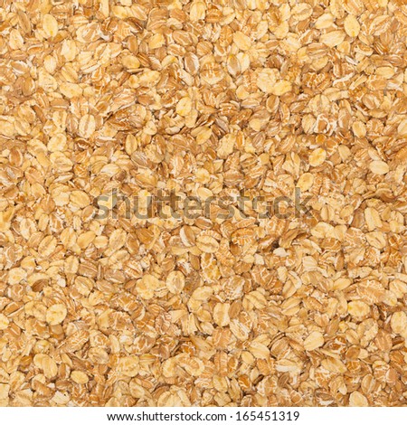 Close up of porridge oats as background or texture. Diet and healthy nutrition. Square format.