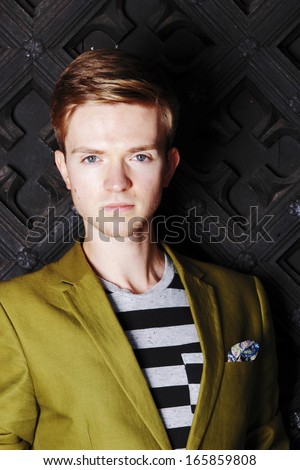 Portrait young handsome man fashion model casual style posing on street of old town Gdansk Poland Europe