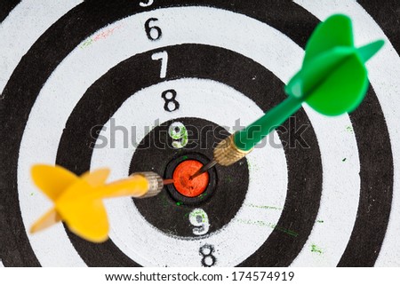 Bullseye. Closeup of old dirty black and white target with darts as sport background. Skeet trap shooting.