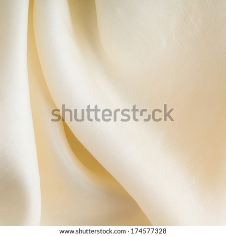 White background abstract cloth wavy folds of textile texture wallpaper design of elegant fabric silk. Square format