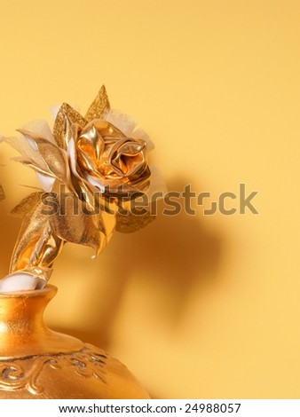 vase of golden rose, decoration, artificial flower on orange background