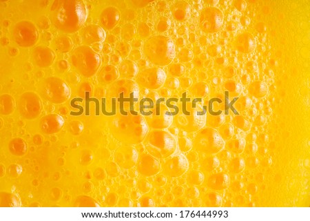 Diet healthy nutrition. Fresh yellow fruits juice background texture. Orange water bubbles. Macro
