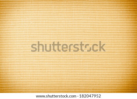 Brown or beige background texture backdrop of close-up macro of striped textile