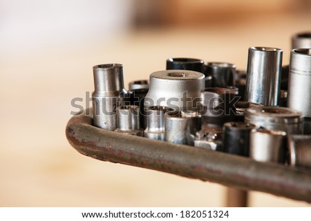 Assortment kit of adjustable metallic tools in mechanic garage car service