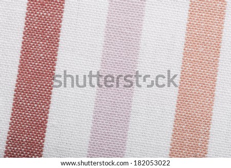 Closeup of colorful pink violet white striped fabric textile as background texture or pattern. Macro.