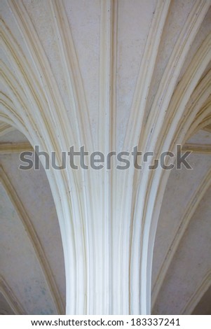 Closeup of white vault ceiling supported by old columns as architectural part. Ancient style of architecture.