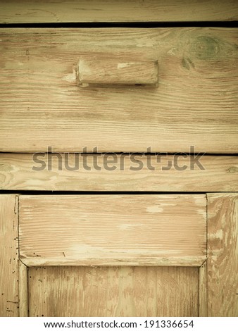 Furniture part. Retro style. Closeup of vintage wooden kitchen cabinet or cupboard as background.