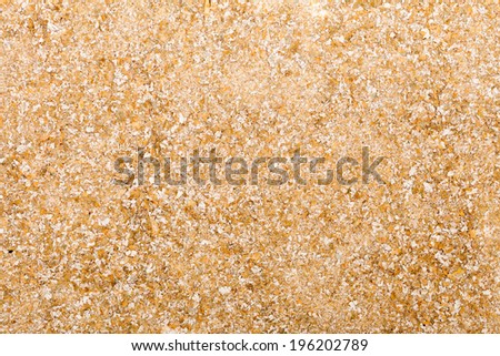 Close up of bran as beige food background or grain texture. Diet and healthy nutrition.