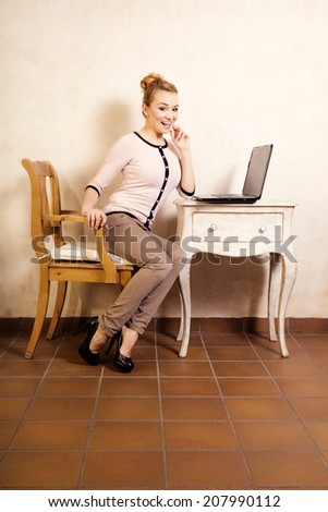 Technology internet modern lifestyle. Full length of young businesswoman woman student girl working on computer laptop at the retro desk. Business at home.