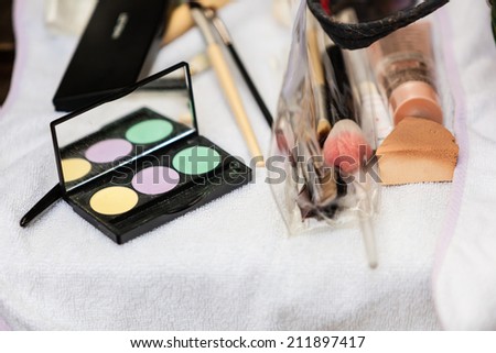 Beauty and makeup. Make up set  brushes and various decorative cosmetics on table