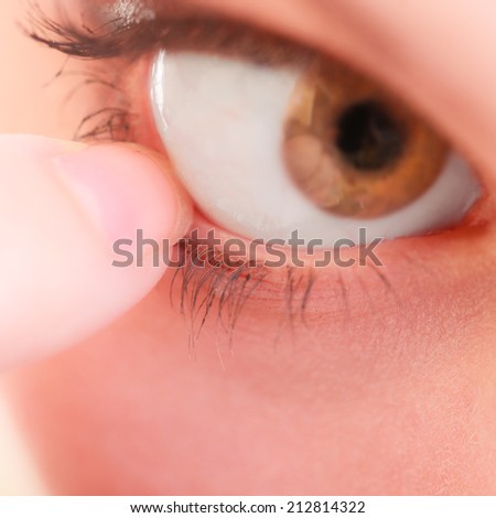 Part of face female eyes. Medicine healthcare human eye pain foreign body.