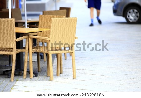 Outdoor restaurant open air cafe chairs with table