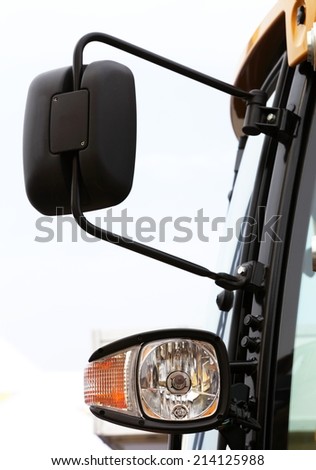 The Image of Semi Truck Mirror and Headlight Detail