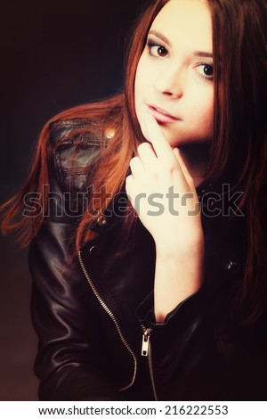 Young people teenage concept - beauty pensive serious woman teenager girl in rock goth style portrait on black
