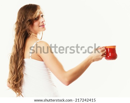 Relax, home, happiness and people concept. Young woman sleepy girl sitting relaxing on bed at morning with cup of tea coffee