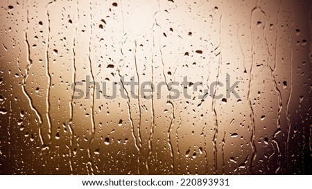 Closeup of water drops droplets raindrops on glass window as background texture. Rain.
