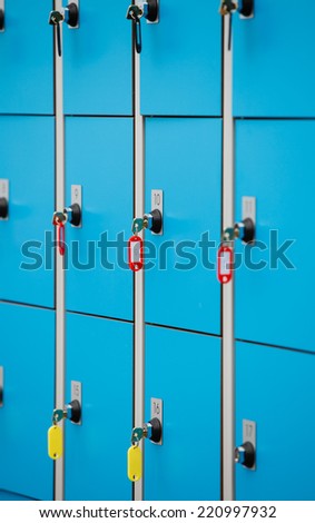 closeup blue deposit boxes with keys. left luggage checkroom background