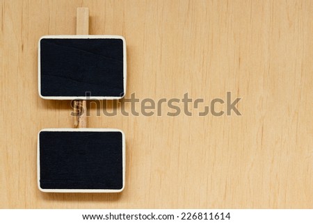small blackboards slate chalk boards with space for text menu on wooden surface, empty blank sign