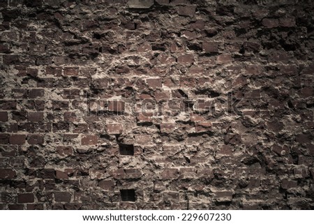 Old grungy destroyed background of a red dark brick wall texture