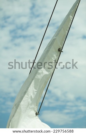 Yachting. Sailboat view of different parts of yacht, sail with rope. Detail of a sailing boat