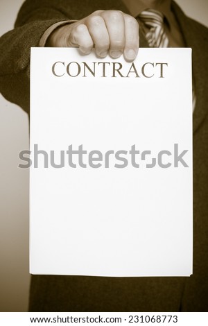 Business concept signing contract.  Businessman holding blank empty paper sheet with sign contract and space for text. Sepia tone