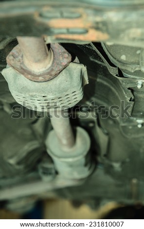 Auto repair shop. Car in service inspecting or repairing. Automobile suspension detail.