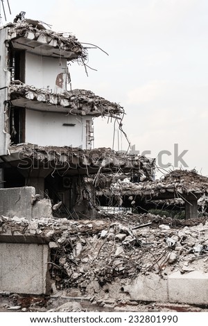 Urban scene. Dismantling of a house. Ruins of building under destruction. Industry.