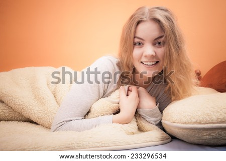 Wake up. Lovely young woman waking up happily after good night sleep, smiling girl in the morning in bed.