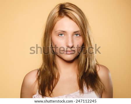 Skin care. Attractive blonde woman with no makeup, fresh face with natural make up, brown background