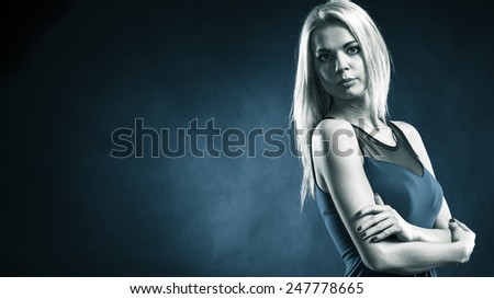 Party, new year, celebration, disco concept - Portrait attractive fashion woman, blonde long hair girl in evening dress night club dark blue background