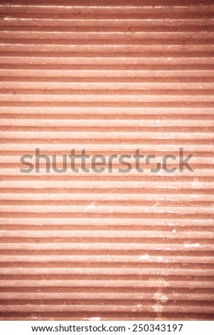 Architectural detail. Closeup of red striped wooden surface as background texture or pattern.