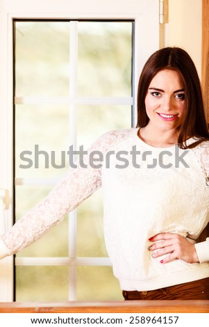 People and relax concept. alone woman long hair looking dreaming through window indoor