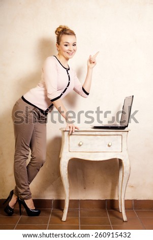 Technology internet modern lifestyle. Full length of businesswoman woman student girl working on computer laptop showing copy space. Business at home.
